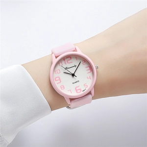Pink jelly silicone sports watch worn on wrist with clear numeric dial display
