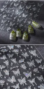 Macro detail of laser holographic butterfly nail stickers with white silk printing