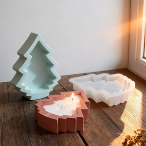 Christmas tree silicone molds set for DIY candle making on a rustic wooden table