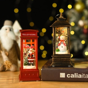 Lighted Christmas water lanterns featuring Santa and snowman in vintage telephone booth