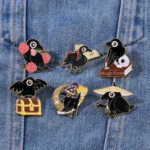 Set of six cartoon crow enamel pins with diverse themes on blue denim background