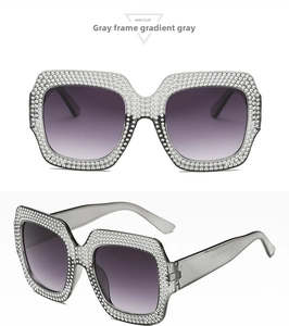 Macro detail of oversized square sunglasses with sparkling rhinestones and gradient lenses