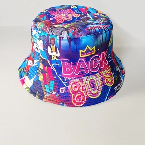 Detailed close-up of retro 80s graffiti print bucket hat featuring vibrant streetwear art