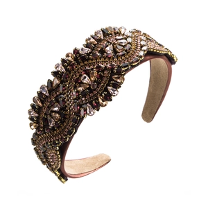 Close-up of baroque headband showing intricate purple crystal beadwork and suede lining