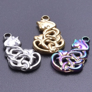 Detailed view of Celtic knot cat pendants in silver, gold, and rainbow finish