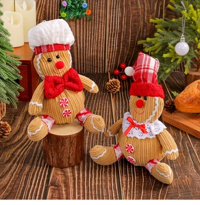 Detail of plush gingerbread man hanging ornaments with chef hat and corduroy texture