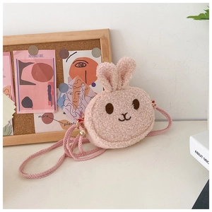 Close-up of pink plush bunny crossbody bag showing soft lamb wool texture and cute ears
