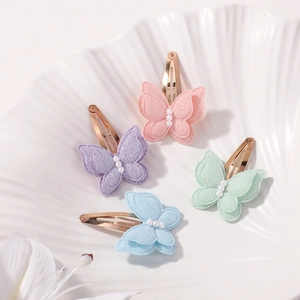 Detailed close-up of double-layer lace butterfly hair clips with elegant pearls