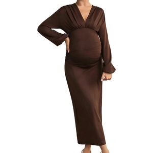 Detailed view of the smooth satin fabric and V-neckline on the maternity long sleeve dress
