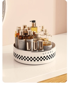 Detailed view of rotating storage tray with modern black and white checkerboard pattern
