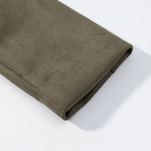 Close-up of olive green faux suede fabric texture and cuff detail on a loose jacket
