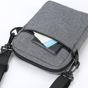 Minimalist grey fabric crossbody shoulder bag with adjustable strap and front pocket