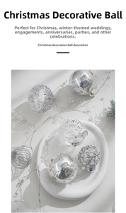 Close-up of silver and transparent 8cm Christmas baubles with sequins and mesh patterns