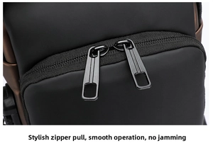 Detail of premium dual metal zippers on waterproof black fabric with brown trim