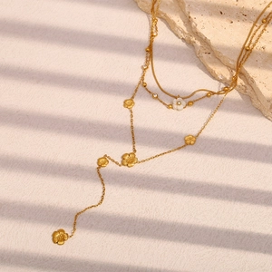 Three-layer 18K gold plated stainless steel fringe necklace with floral charm pendants