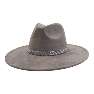 Detail of grey suede fedora hat featuring a sparkling silver rhinestone encrusted band