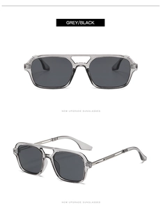 Detail view of grey transparent pilot sunglasses with double bridge and black lenses