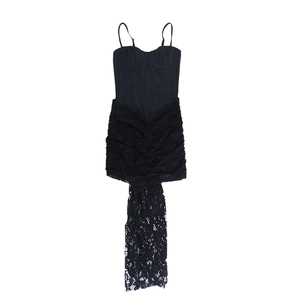 Close-up of black sleeveless dress with elegant lace patchwork and strapless design