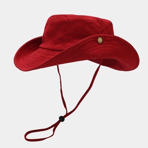 Detail of red cotton bucket hat with copper side buttons and adjustable chin strap