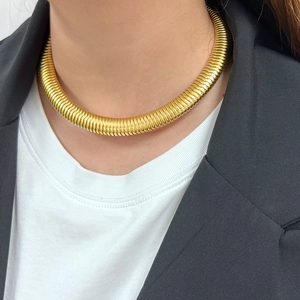 Punk style wide ribbed 18K gold plated metal choker necklace for women on model