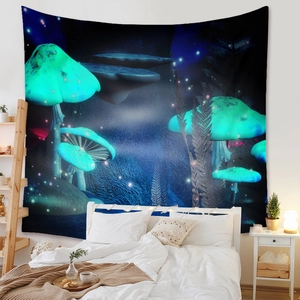 Detail of bohemian tapestry featuring glowing mushrooms hanging above a cozy bedroom bed
