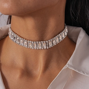 Close-up of luxury silver-tone choker with sparkling rectangular rhinestones on model