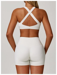 Close-up back view of white high-waist yoga shorts with booty lifting seam design
