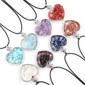 Set of eight heart-shaped crystal stone pendants on black cords in various vibrant colors