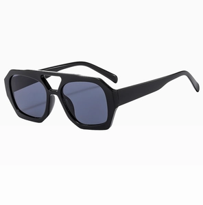 Detailed 45-degree angle view of classic black geometric aviator sunglasses with dark lenses