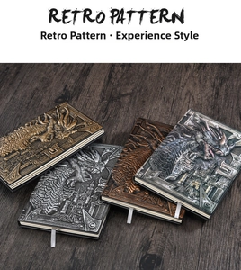 Detail of A5 PU leather notebooks with 3D embossed dragon and castle designs