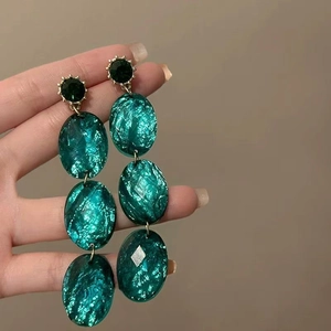 Retro long green drop earrings with triple oval resin stones and golden sparkling studs