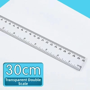 Close-up of 30cm transparent ruler with precise dual metric and inch measurements