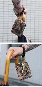 Detail of leopard print PU leather card holder with silicone beaded wristlet keychain