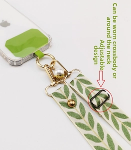 Adjustable leaf pattern phone strap with pearl charm, metal clips and green padding