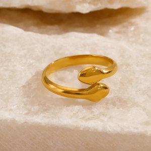 Minimalist double-headed snake ring in 18K gold plated stainless steel on white stone