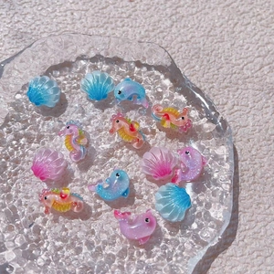 Sparkly resin ocean charms set with glitter sea horse dolphin and shell shapes
