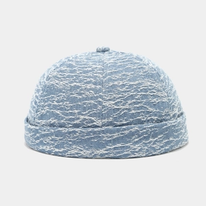 Detail of blue textured docker hat showing retro washed fabric and ribbed material