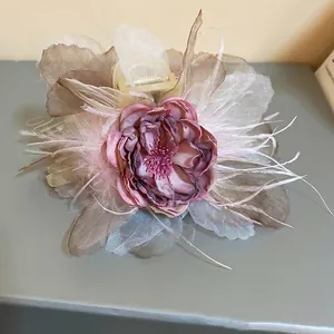 Elegant flower hair claw clip with pink silk roses and delicate white feathers accessory