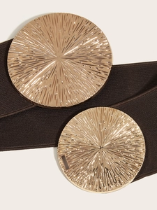 Macro view of wide stretch belt with brown fabric texture and sunray engraved gold buckles