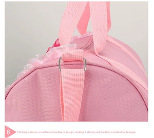 Close-up of pink dance bag showing metal hardware reinforcement and durable stitching
