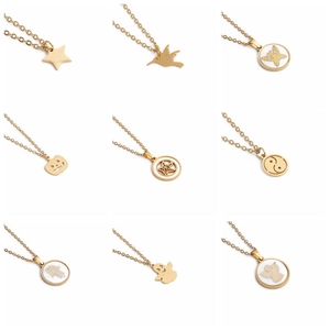 Collection of nine gold hummingbird and celestial pendant necklaces in stainless steel