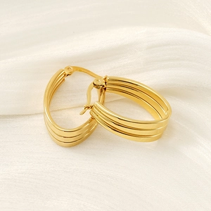 Three-layer parallel gold hoop earrings in polished stainless steel with snap closure