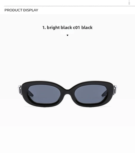 Glossy black oval sunglasses featuring dark grey lenses and a sleek retro vintage design