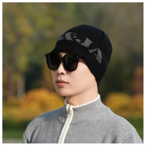 Close-up of a men's black knit beanie with gray lettering and high elasticity material