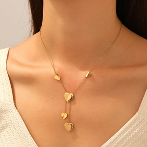 Minimalist gold plated stainless steel heart tassel Y-necklace worn by a model