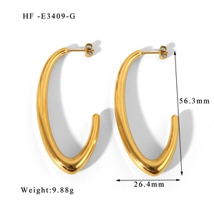 Detailed size measurement showing 56.3mm length of gold hollow C-shaped earrings