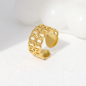 Detail of golden double chain link open ring with high-polish metallic finish