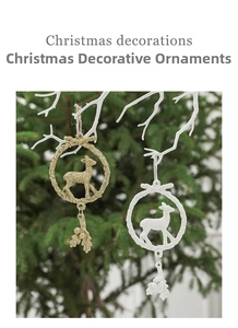 Detailed view of white and gold reindeer ornaments for festive Christmas tree decoration