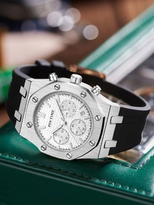 Detail of silver chronograph men's watch with white grid dial and black rubber strap