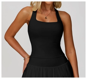 Detail of black racerback sports vest with square neck and pleated tennis skirt set